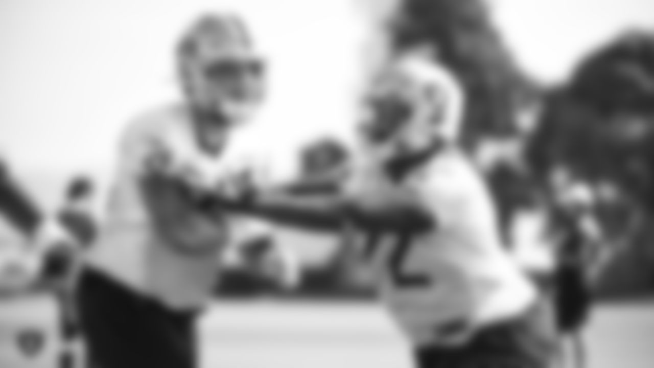 Raiders guard Richie Incognito (64) and tackle David Sharpe (72) go through offensive drills during practice at the Raiders Practice Facility.