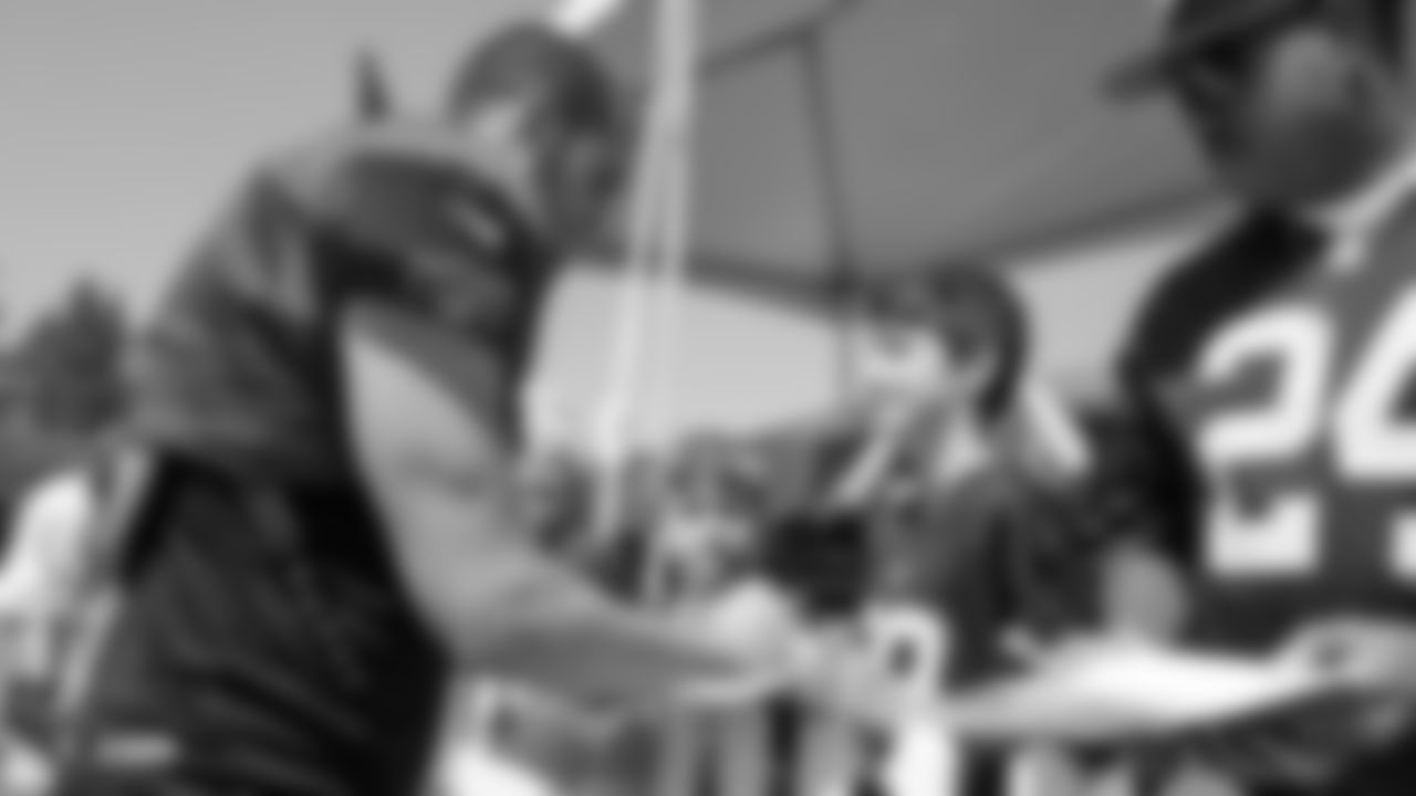 Oakland Raiders quarterback Derek Carr (4) signs autographs for fans after practice at 2018 Training Camp at The Oakland Raiders Napa Valley Training Complex, Monday, August 13, 2018, in Napa, California.