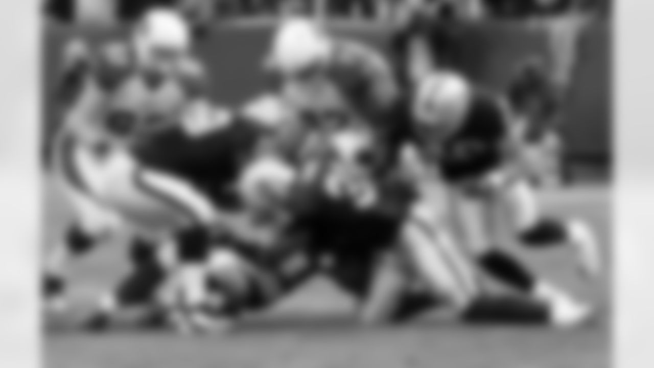 S Hiram Eugene brings down the ball carrier.