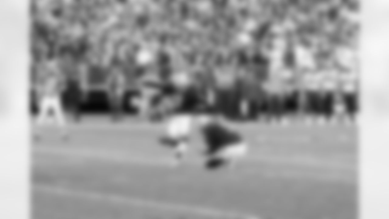 K Sebastian Janikowski kicks an extra point.