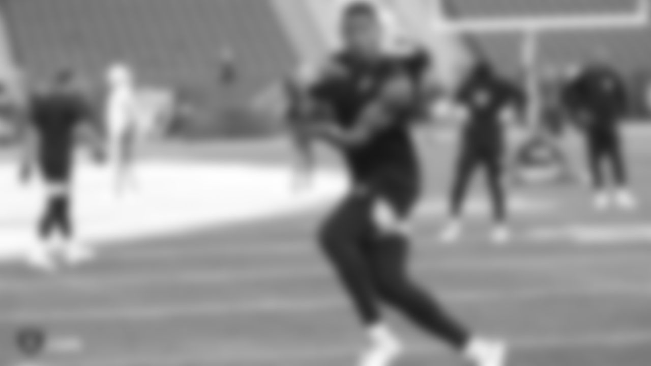 The Raiders warm up before their preseason game against the Green Bay Packers at IG Field.