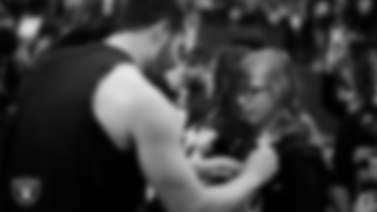 Las Vegas Raiders quarterback Derek Carr (4) signs an autograph for Make-A-Wish's William Spooner before the regular season home game against the Los Angeles Chargers at Allegiant Stadium.