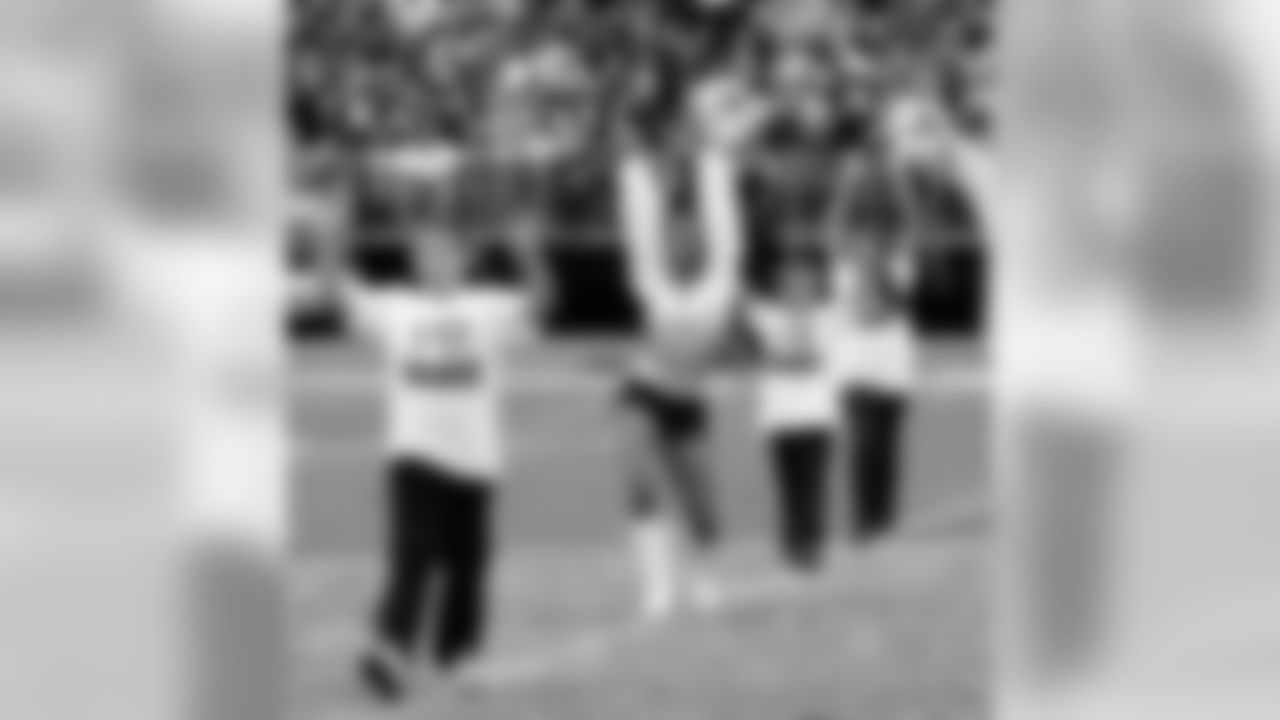Dance studios perform with the Raiderettes at halftime.
