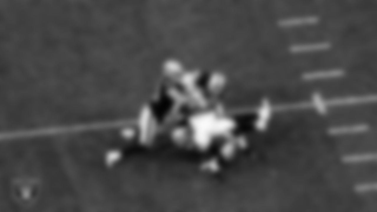 Las Vegas Raiders linebacker Nick Kwiatkoski (44), safety Lamarcus Joyner (29) and linebacker Nicholas Morrow (50) make a tackle during the regular season home game against the Indianapolis Colts.