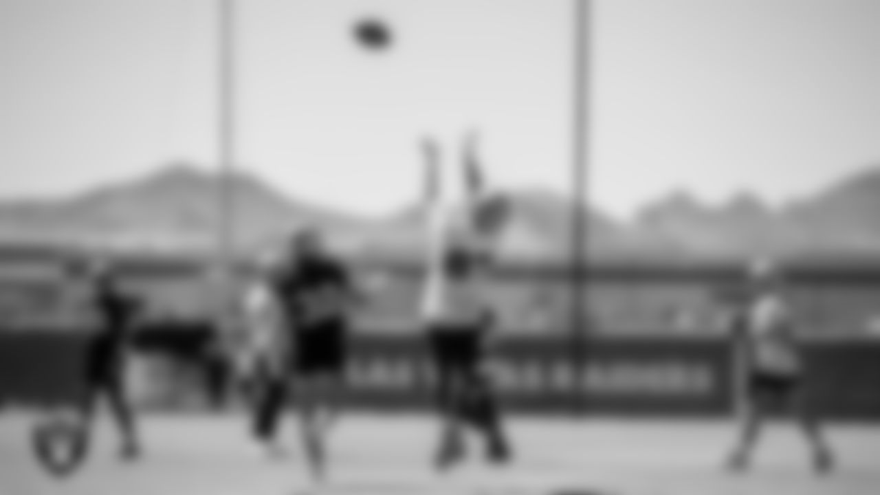Las Vegas Raiders safety Dallin Leavitt (32) and tight end Foster Moreau (87) at an Organized Team Activity (OTA).