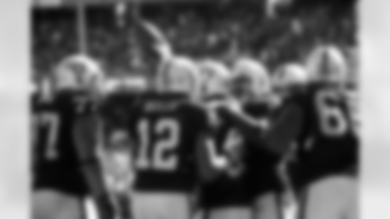 WR James Jones is surrounded by his teammates after scoring the touchdown.