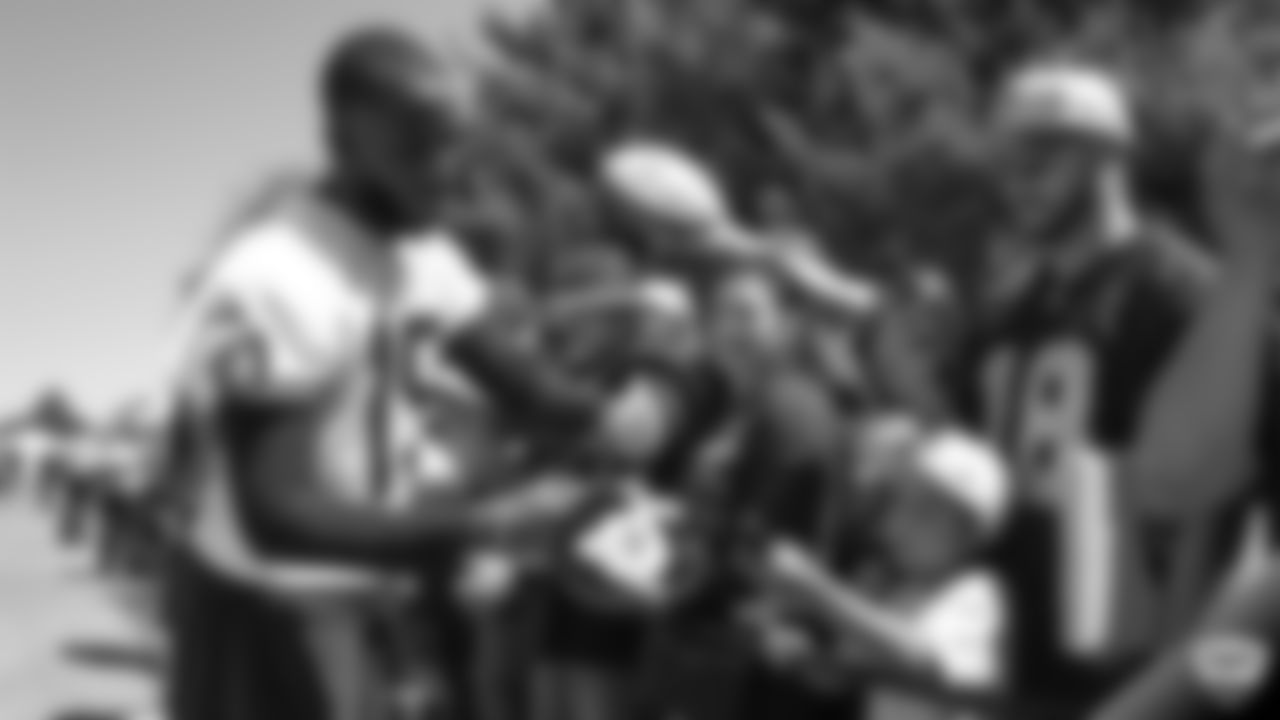Raiders wide receiver J.J. Nelson (15) signs autographs for fans after practice at 2019 Training Camp.