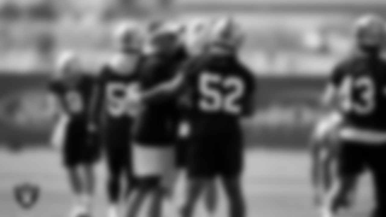 Las Vegas Raiders Head Coach Josh McDaniels and linebacker Denzel Perryman (52) during Day Two of 2022 Veteran Minicamp.
