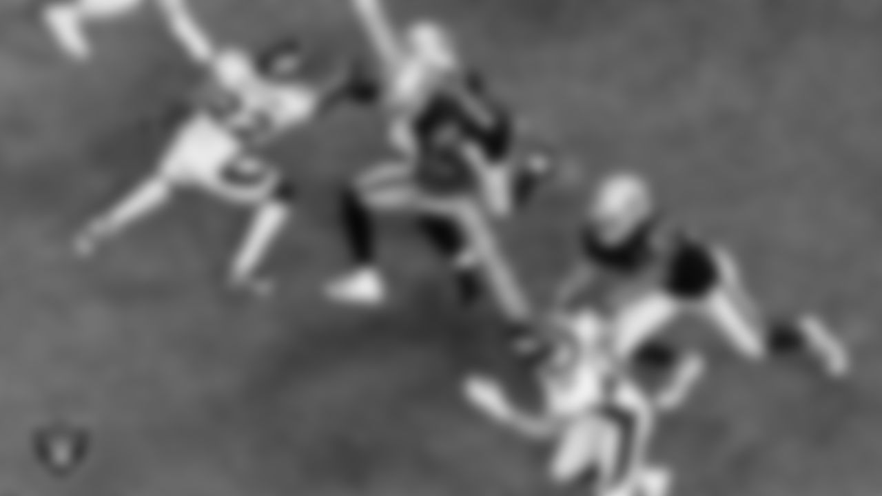 Las Vegas Raiders running back Josh Jacobs (28) rushes as wide receiver Henry Ruggs III (11) and tight end Darren Waller (83) block during the regular season home game against the Denver Broncos.