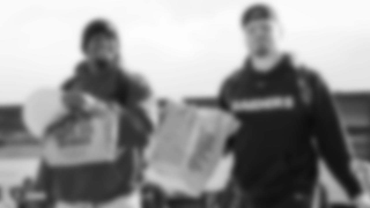 Raiders defensive end Clelin Ferrell (96) and defensive end Maxx Crosby (98) depart for the game against the Kansas City Chiefs.