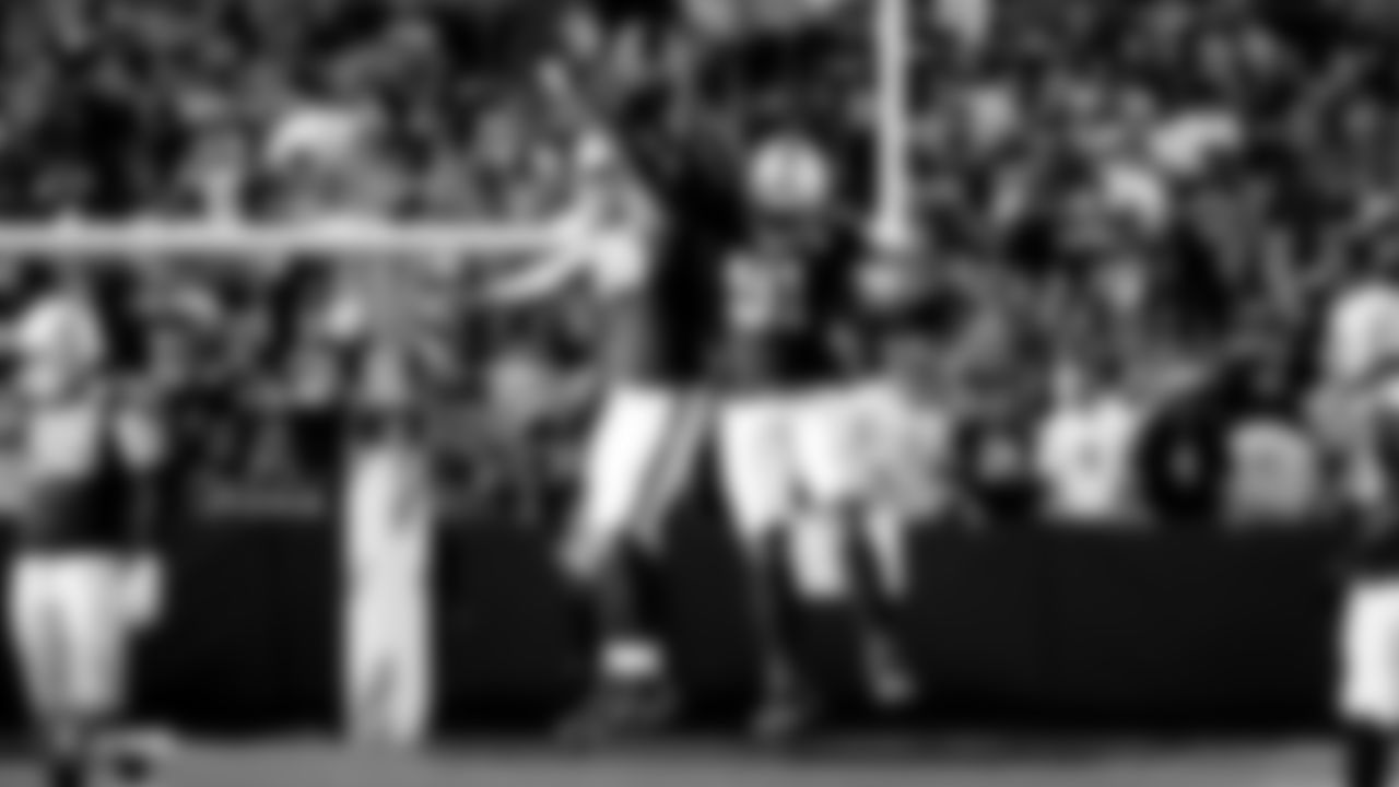 Raiders defensive end Clelin Ferrell (96) and defensive end Benson Mayowa (91) celebrate after making a tackle during the regular season game against the Detroit Lions.