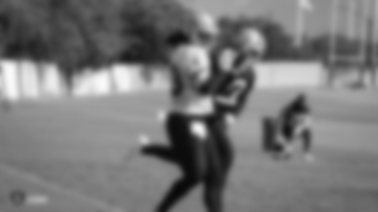Raiders tight end Darren Waller (83) makes a catch as cornerback Keisean Nixon (22) defends during practice at the Raiders Practice Facility.