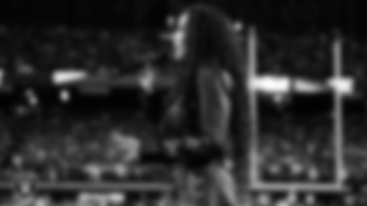 Singer and actress, Tinashe, performs the national anthem before the Las Vegas Raiders regular season home game against the Kansas City Chiefs.
