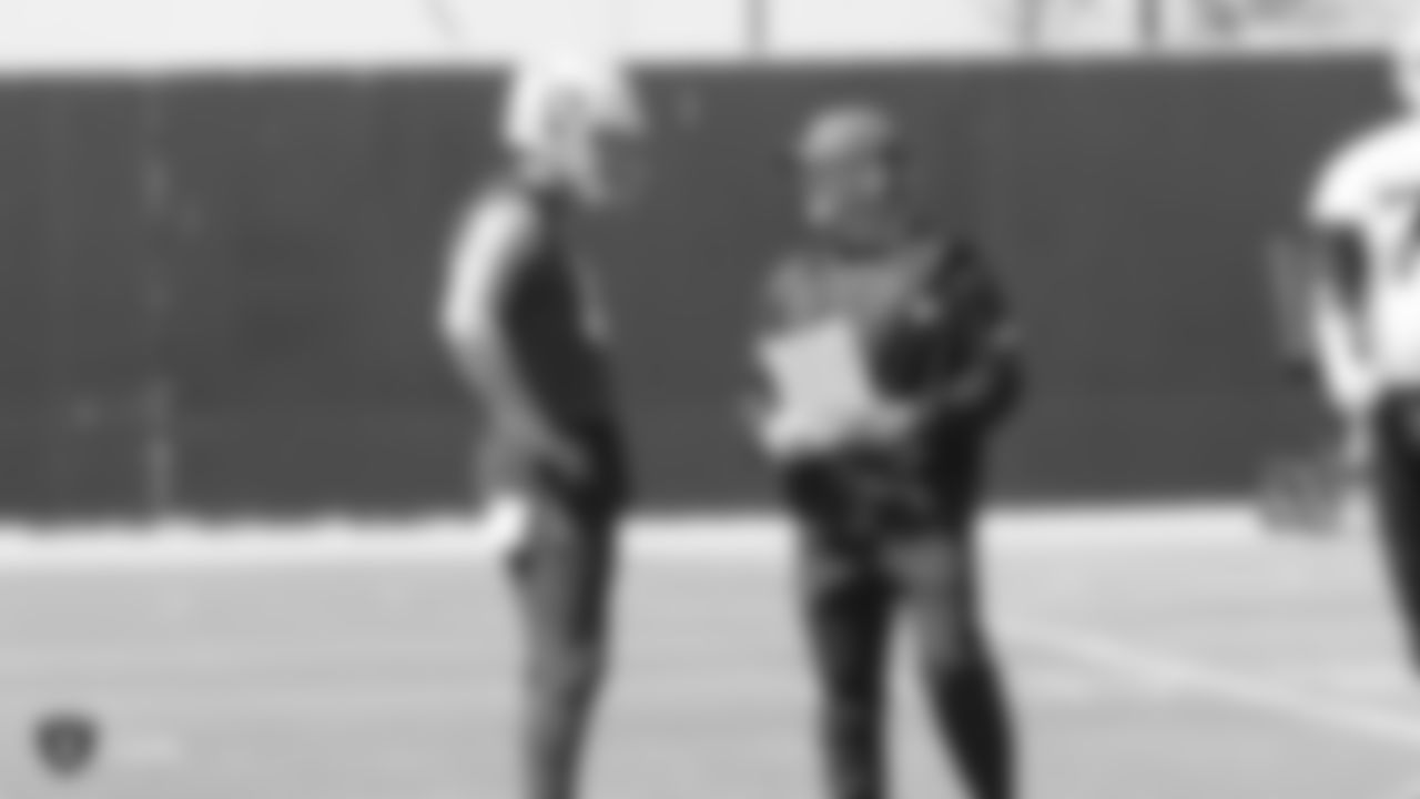 Raiders quarterback Derek Carr (4) and head coach Jon Gruden at an Organized Team Activity (OTA) at the Raiders Practice Facility in Alameda, Calif.