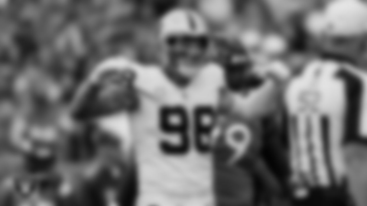 Las Vegas Raiders defensive end Maxx Crosby (98) celebrates after a play during the regular season away game against the Denver Broncos at Empower Field at Mile High.