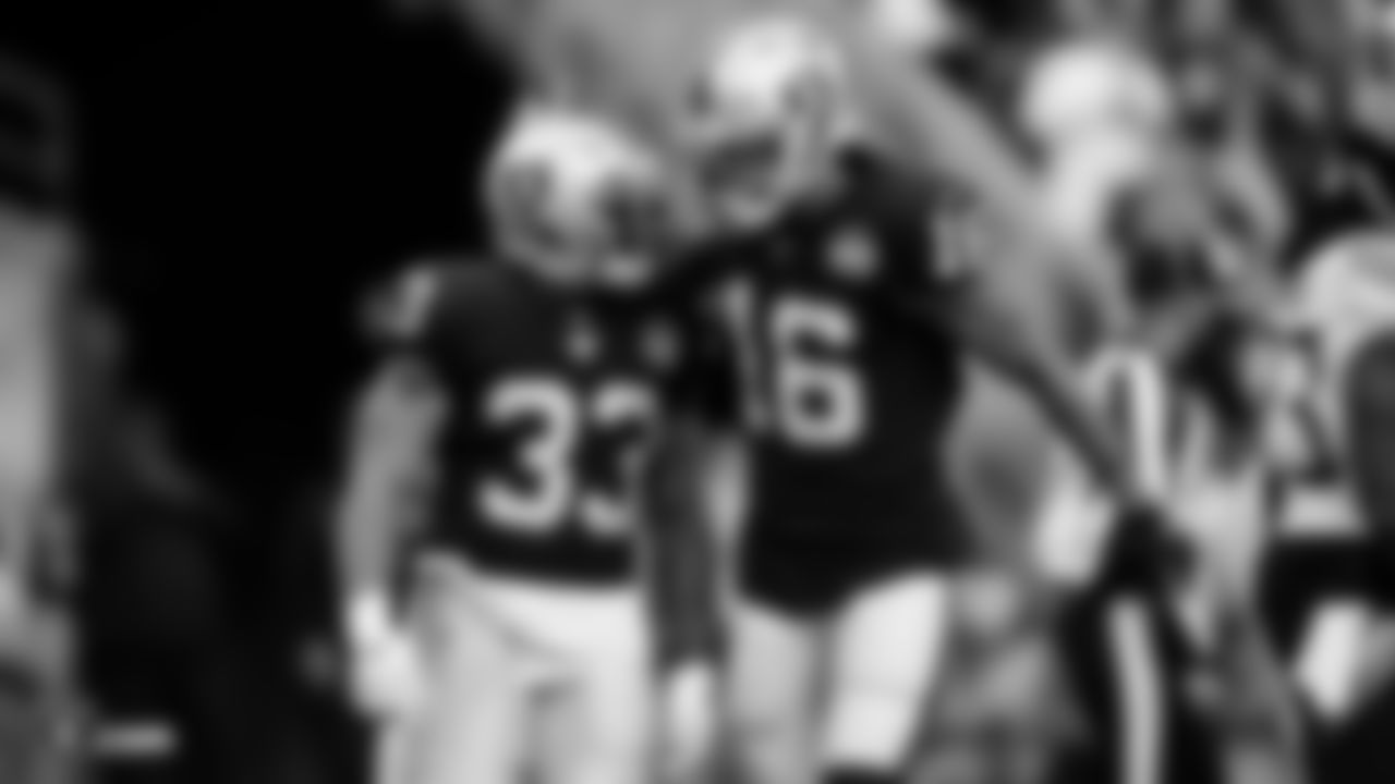 Raiders running back DeAndré Washington (33) and wide receiver Tyrell Williams (16) after a touchdown during the regular season game against the Tennessee Titans at the Oakland-Alameda County Coliseum.