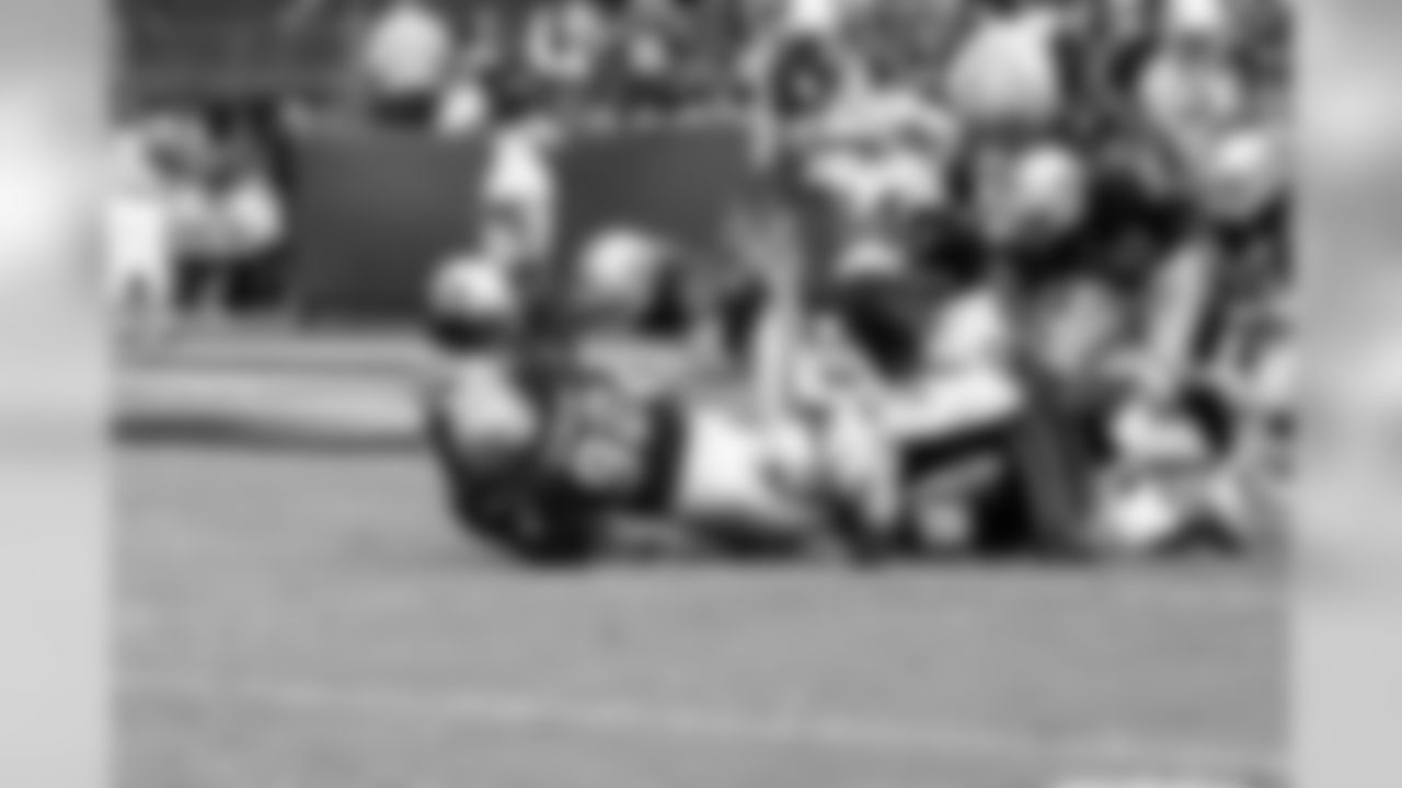 DT Richard Seymour brings down the ball carrier.