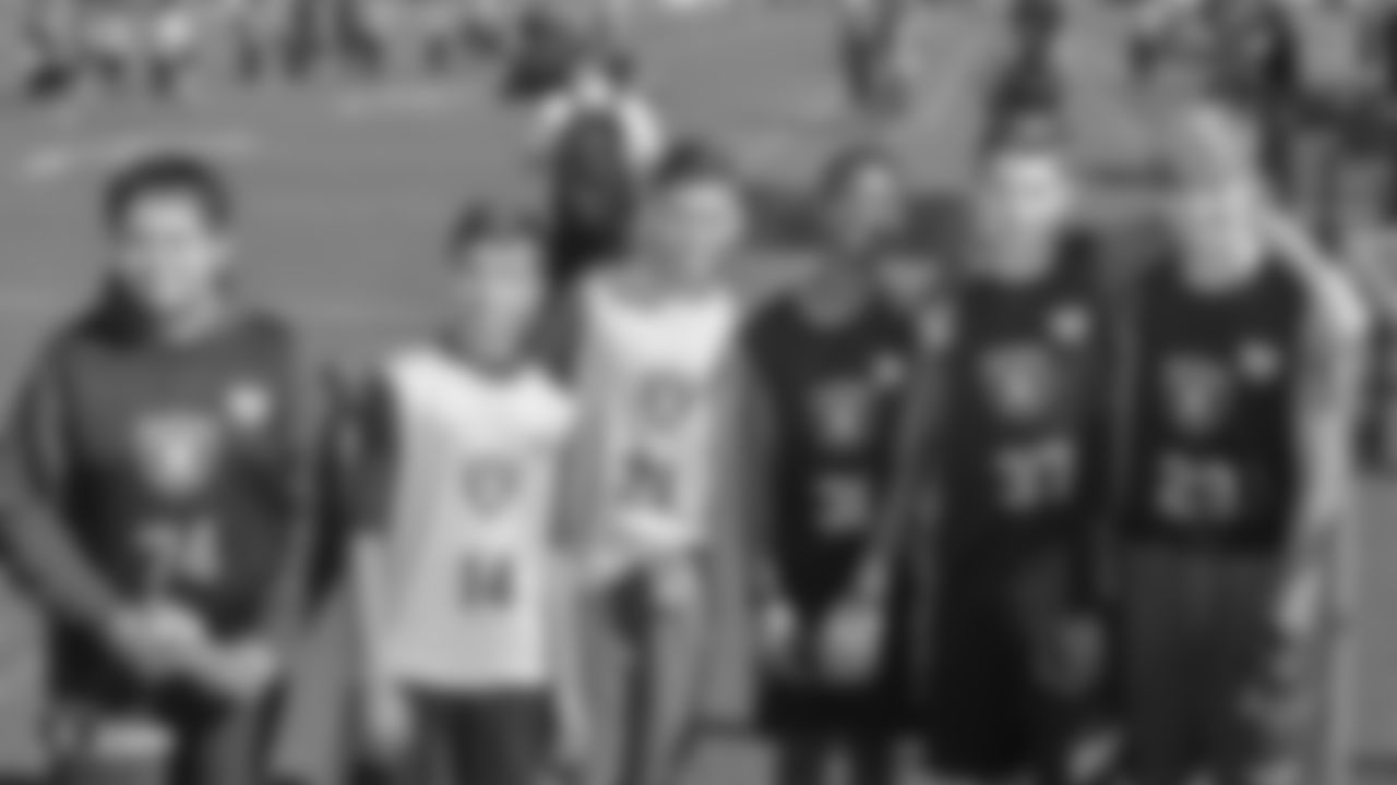 The Raiders, represented by alumnus Leo Gray, collaborate with the Las Vegas Metro Police Activities League to start a 7-on-7 NFL FLAG Passing League for high school junior varsity athletes, Saturday, April 20, 2019, at Rancho High School in Las Vegas, Nev.