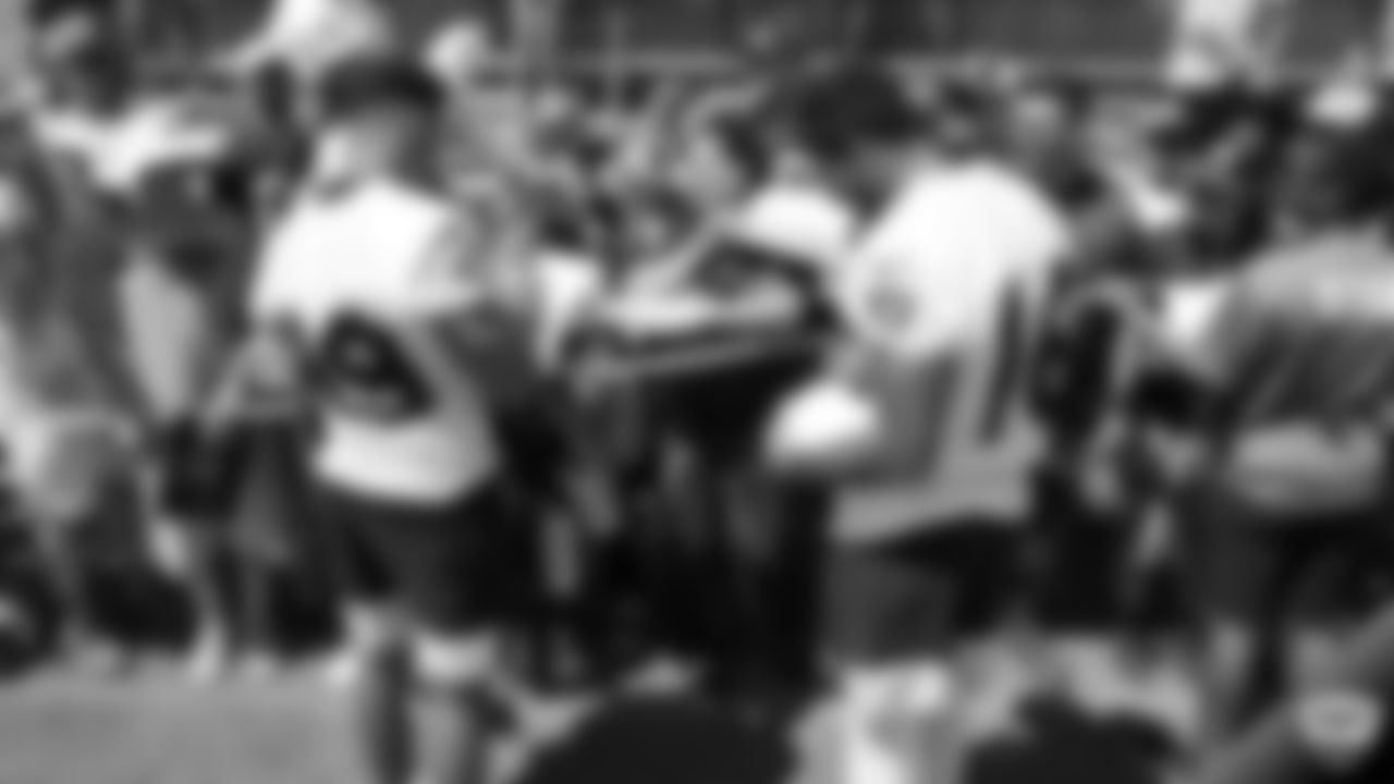 Raiders wide receiver Keelan Doss (89) and wide receiver Tyrell Williams (16) sign autographs for fans after practice at 2019 Training Camp.
