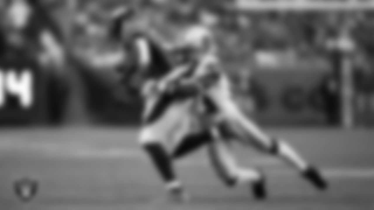 Las Vegas Raiders cornerback Nate Hobbs (39) makes a tackle during the regular season away game against the Denver Broncos at Empower Field at Mile High.