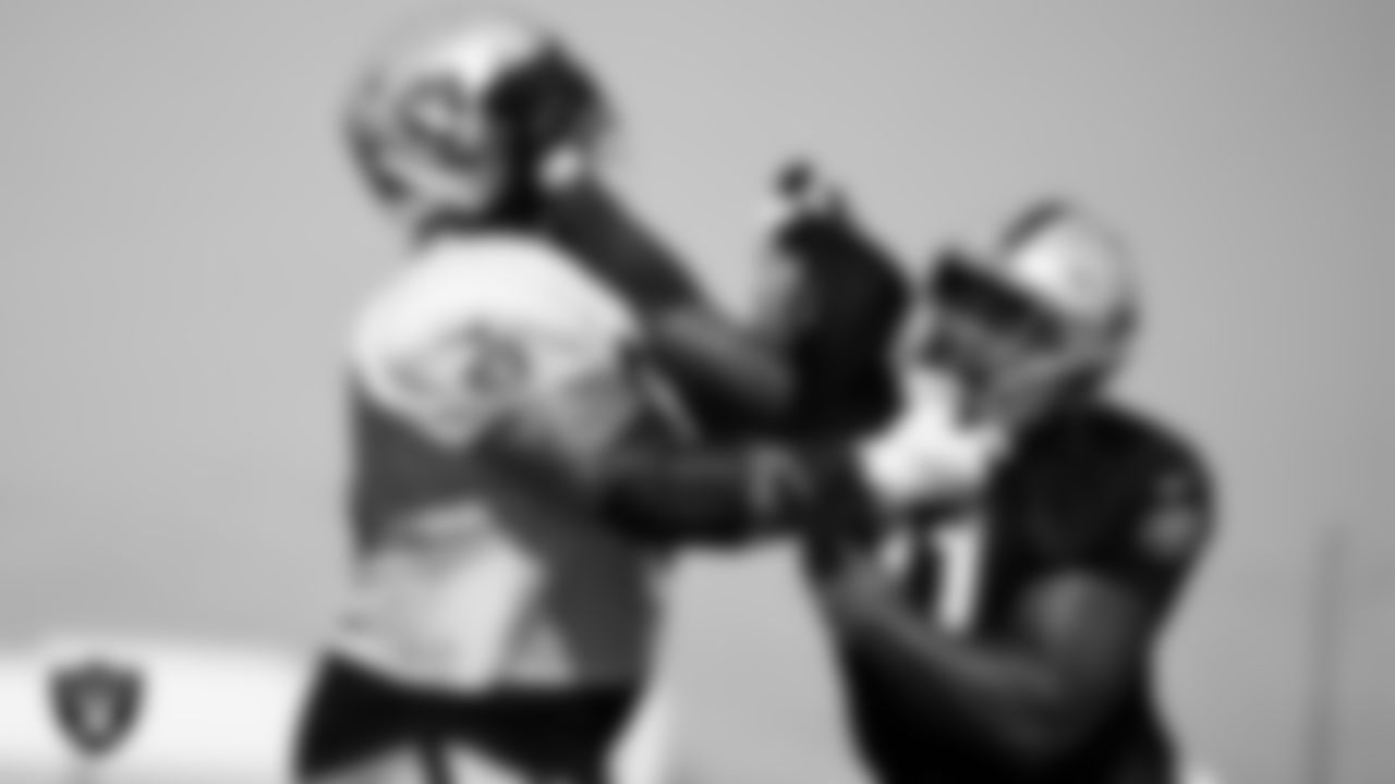 Las Vegas Raiders guard Richie Incognito (64) and defensive end Yannick Ngakoue (91) on the field for practice at 2021 Training Camp.