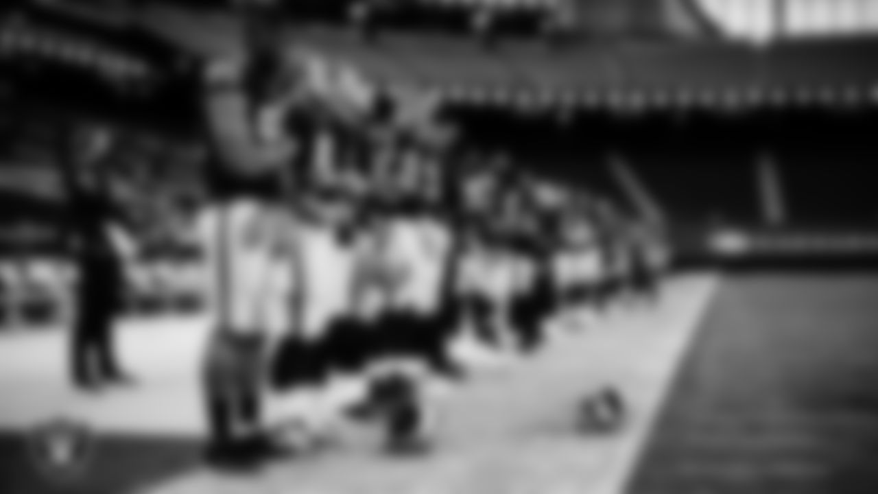 The Las Vegas Raiders during the national anthem before the regular season home game against the Denver Broncos.