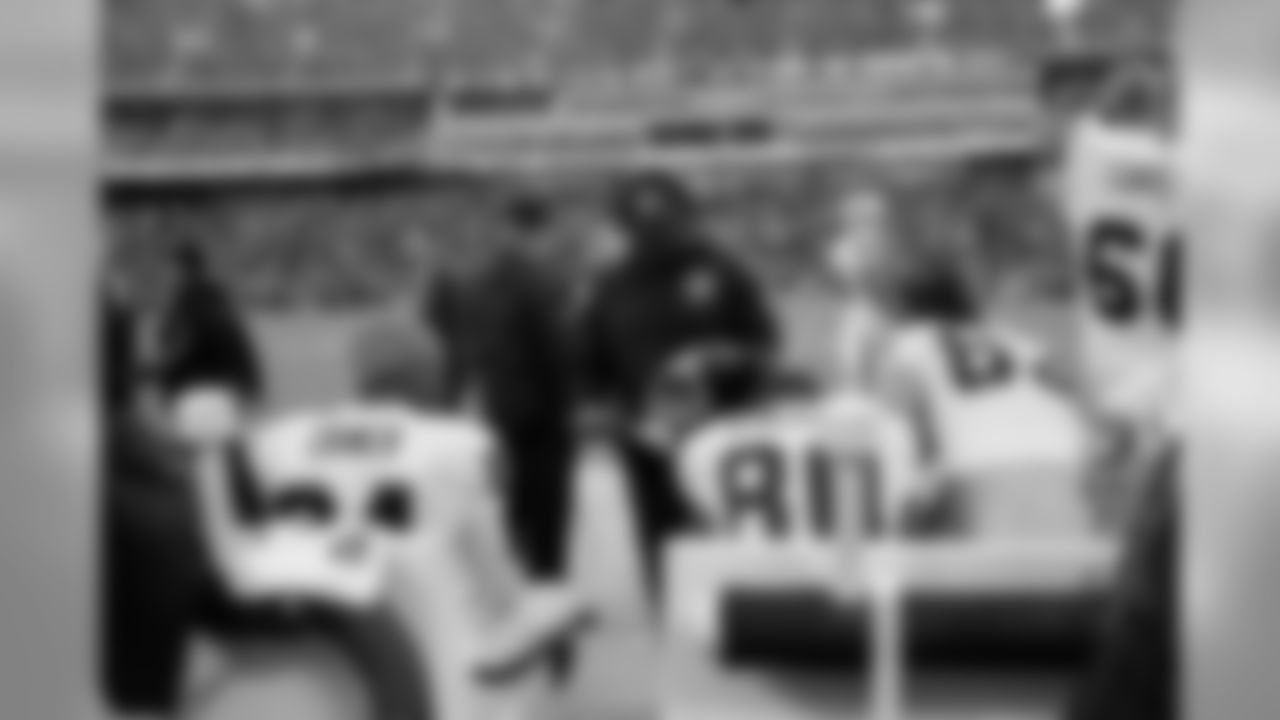Wide receivers coach Ted Gilmore works with his receivers on the sideline.