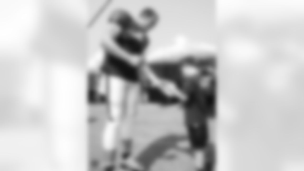 Oakland Raiders quarterback Derek Carr (4) signs autographs for fans after practice at 2018 Training Camp at The Oakland Raiders Napa Valley Training Complex, Friday, August 3, 2018, in Napa, California.