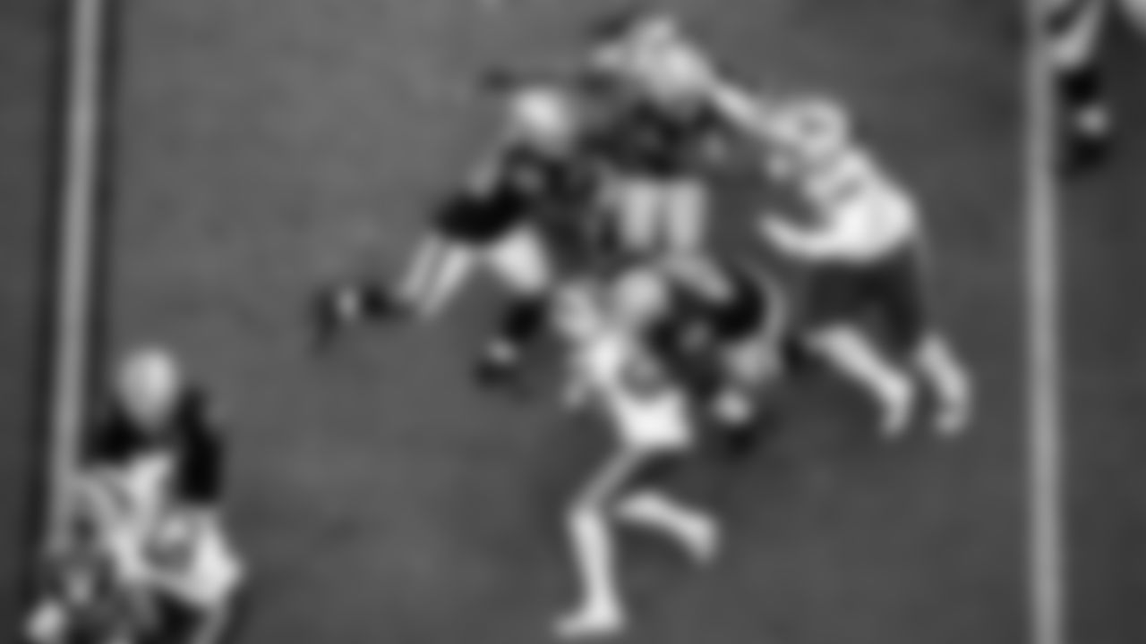 Las Vegas Raiders running back Josh Jacobs (28) rushes as center Rodney Hudson (61) and guard Gabe Jackson (66) block during the regular season home game against the Buffalo Bills.