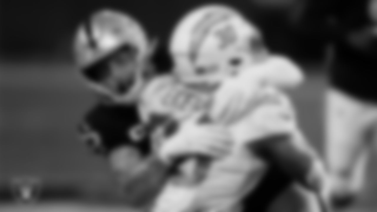 Las Vegas Raiders defensive end Maxx Crosby (98) makes a tackle during the regular season home game against the Los Angeles Chargers.