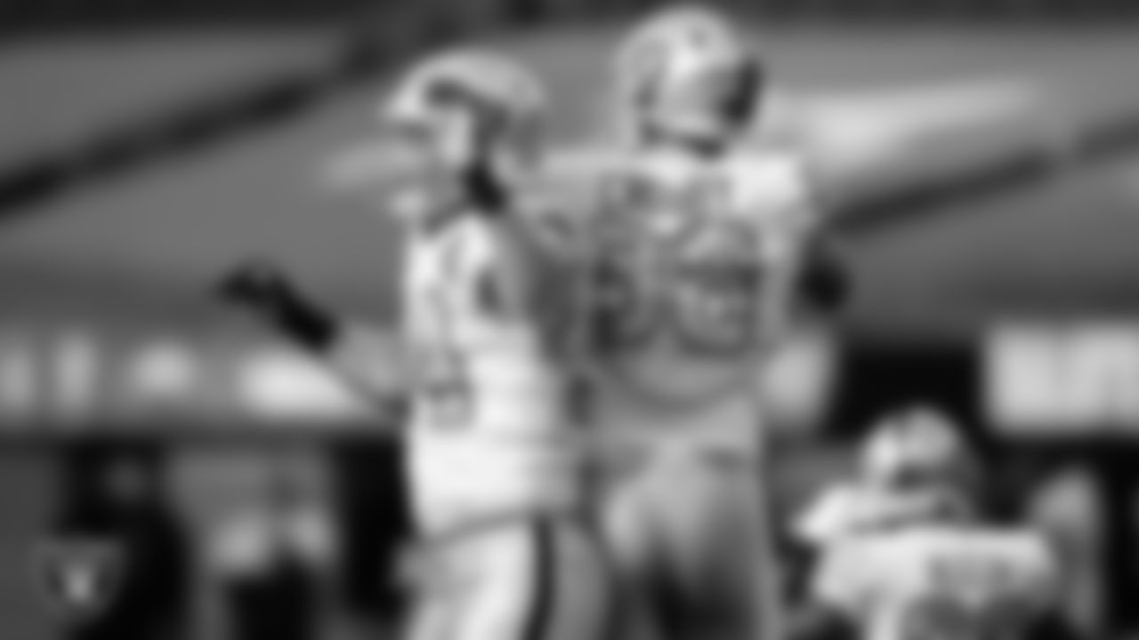 Las Vegas Raiders defensive end Carl Nassib (94) celebrates with defensive end Maxx Crosby (98) after sacking the quarterback during the regular season away game against the Los Angeles Chargers.