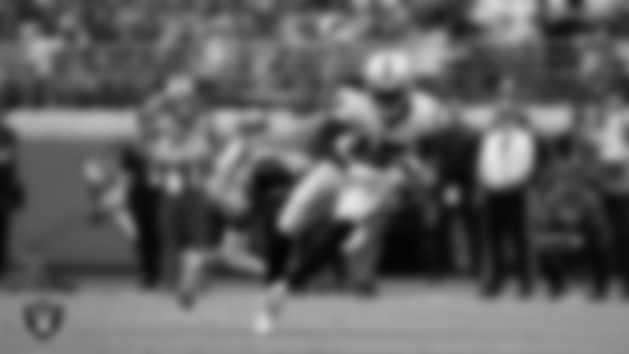 Las Vegas Raiders wide receiver Davante Adams (17) runs after making a catch during the regular season away game against the Jacksonville Jaguars at TIAA Bank Field.