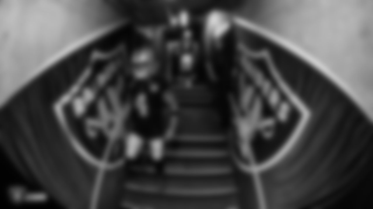Raiders quarterback Derek Carr (4) and quarterback Mike Glennon (7) walk down the tunnel before the Raiders regular season game against the Kansas City Chiefs.