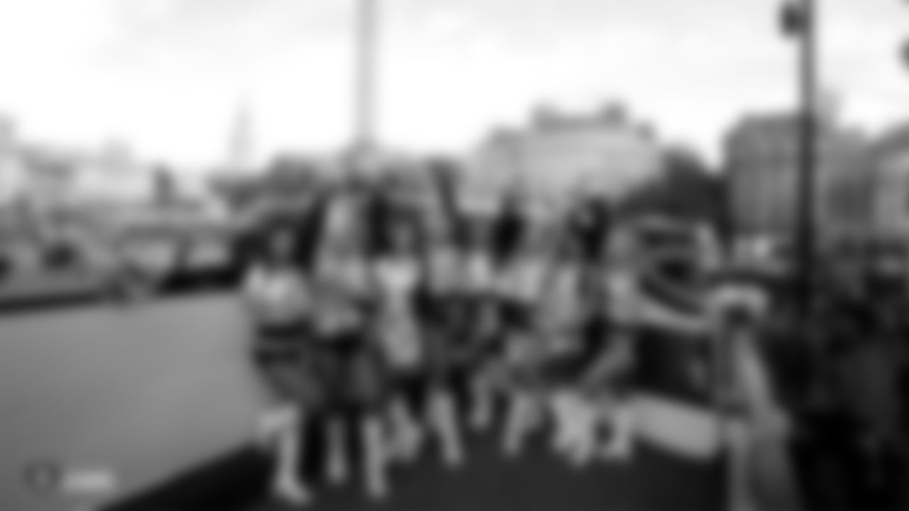 The Raiderettes pose for a photo during the Oakland Raiders Fan Rally at the Admiralty Pub in Trafalgar Square in London on Friday, October 12, 2018.