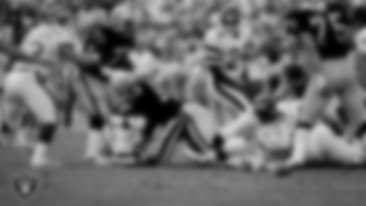 Raiders linebacker Rod Martin (53) sacks the quarterback during the regular season home game against the New York Jets at Los Angeles Memorial Coliseum, Sunday, September 8, 1985, in Los Angeles, Calif.
