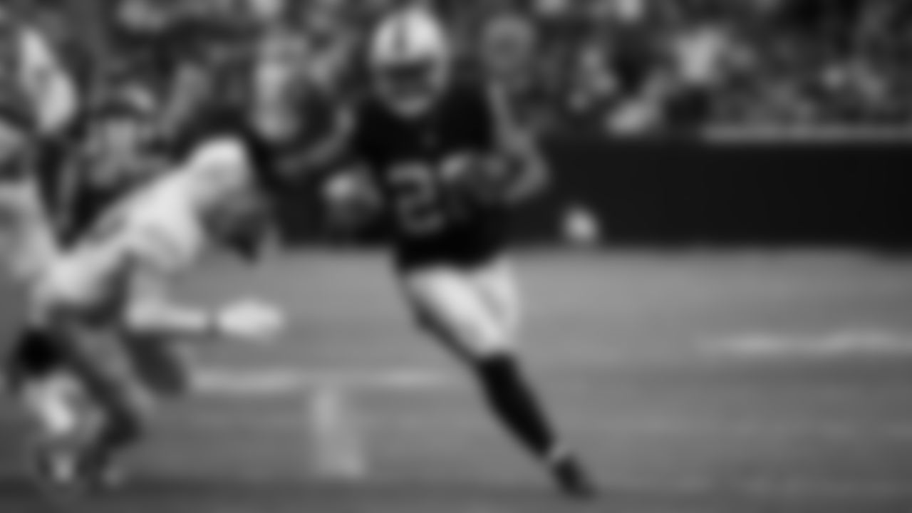 Las Vegas Raiders running back Josh Jacobs (28) rushes for a 20-yard touchdown during the regular season home game against the Los Angeles Chargers at Allegiant Stadium.