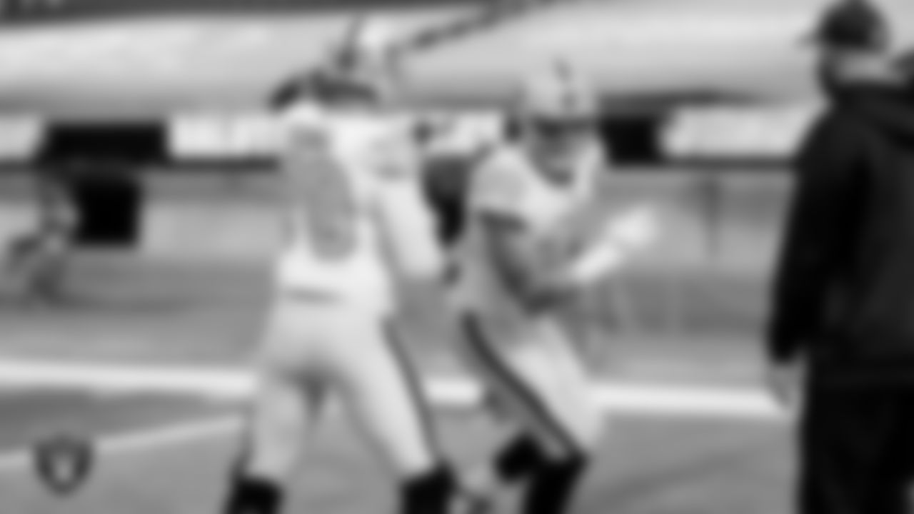 The Raiders warm up before the regular season game against the Los Angeles Chargers at SoFi Stadium.