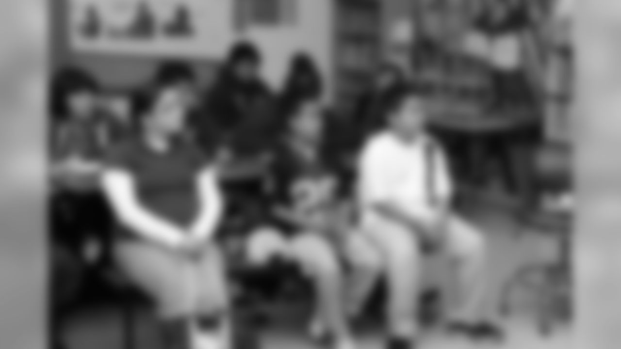 The students listen intently as the guests speak.