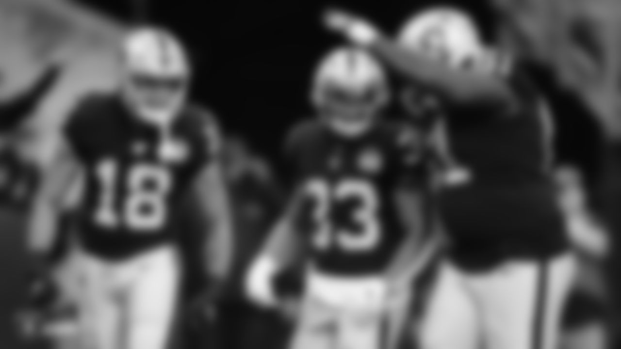 Raiders wide receiver Keelan Doss (18), running back DeAndré Washington (33) and center Rodney Hudson (61) after a touchdown during the regular season game against the Tennessee Titans at the Oakland-Alameda County Coliseum.