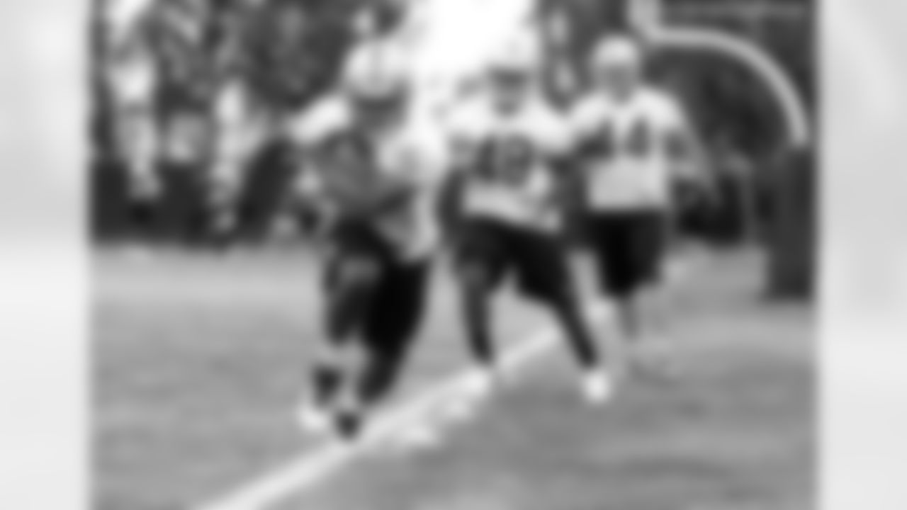 RB Lonyae Miller runs through the drill.