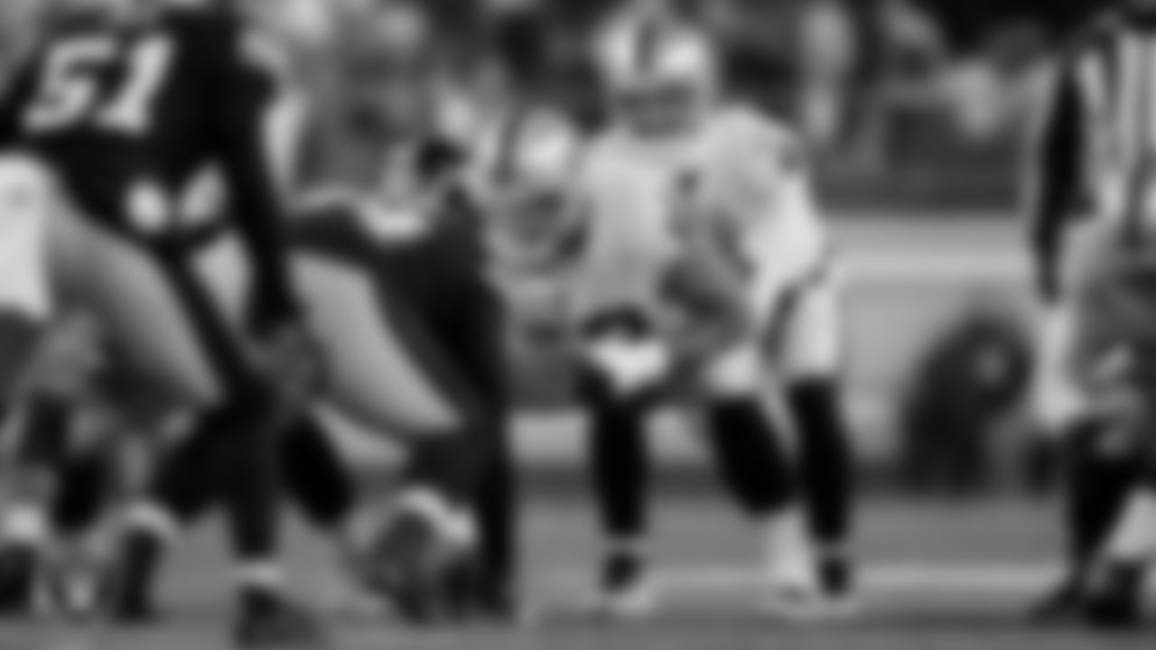Las Vegas Raiders center Andre James (68) and quarterback Derek Carr (4) during the regular season away game against the Pittsburgh Steelers at Acrisure Stadium.