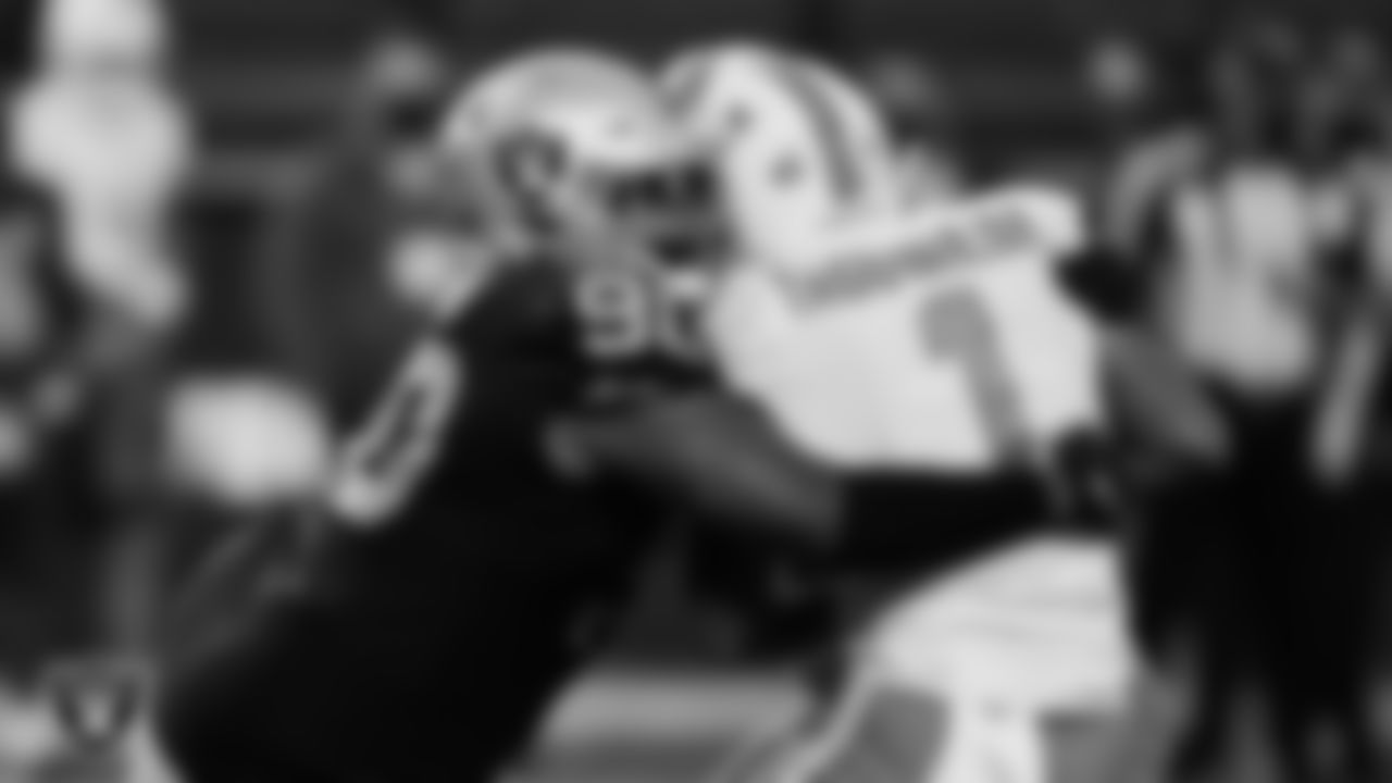 Las Vegas Raiders defensive tackle Johnathan Hankins (90) sacks the quarterback during the regular season home game against the Miami Dolphins.