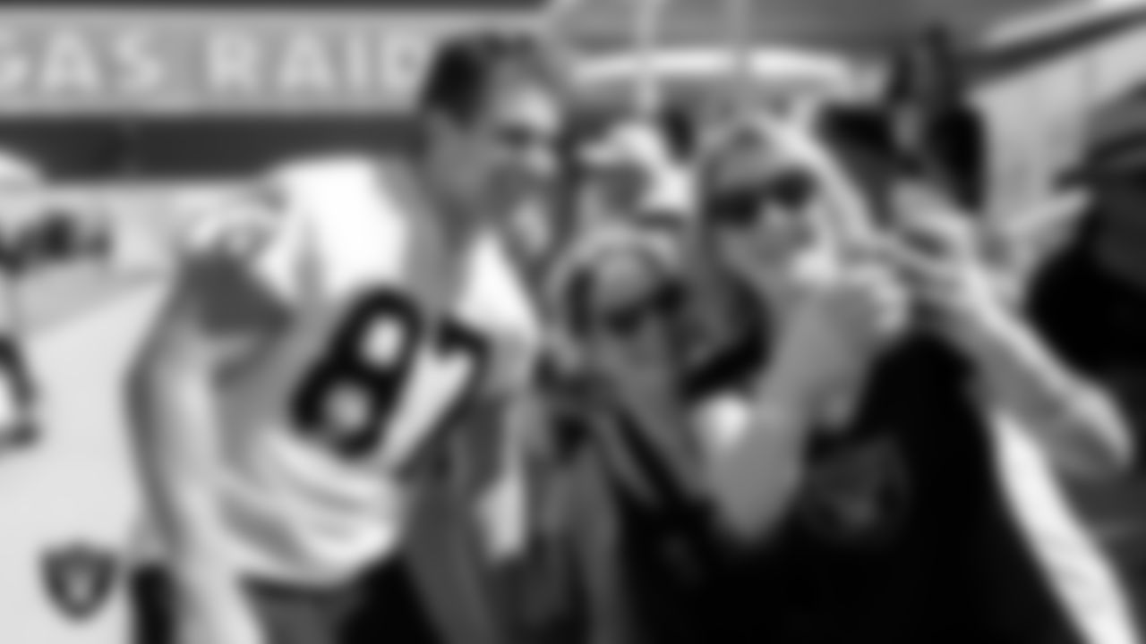 Las Vegas Raiders tight end Michael Mayer (87) poses for a selfie with fans after practice at 2023 Training Camp at Intermountain Health Performance Center.
