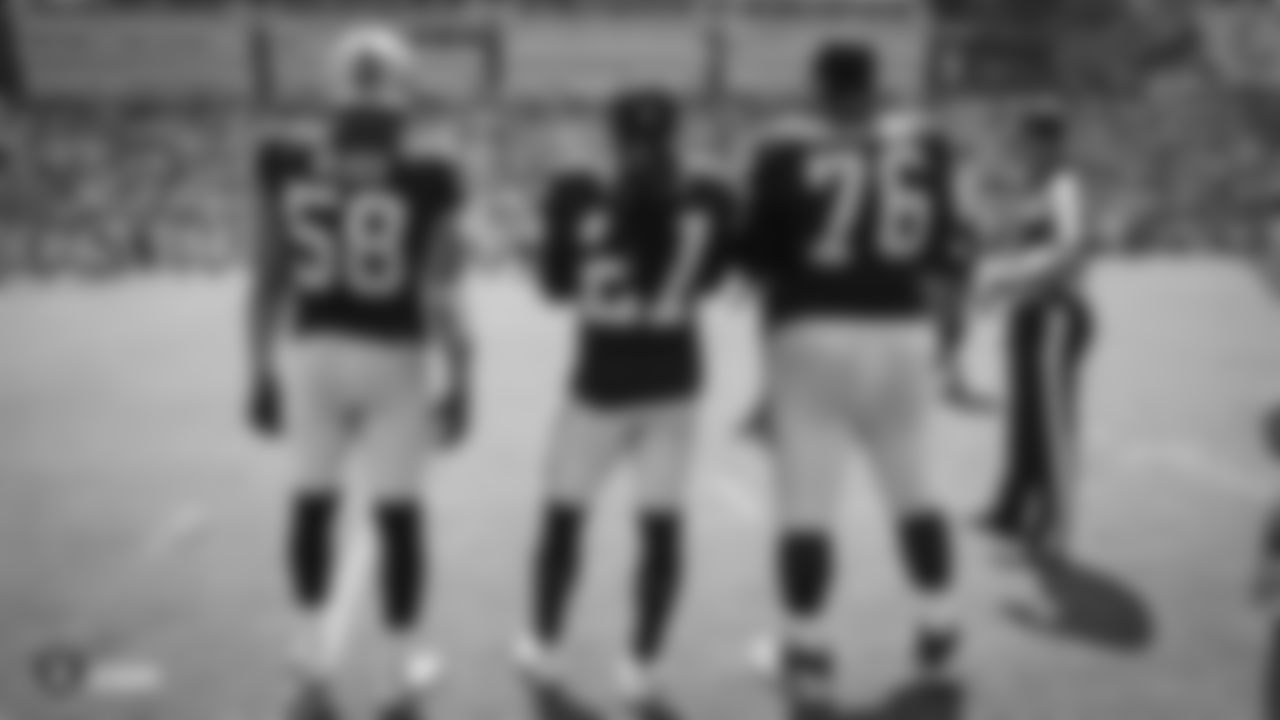 Oakland Raiders linebacker Kyle Wilber (58), safety Reggie Nelson (27), and offensive guard Jon Feliciano (76) on the sidelines before the coin toss at The Oakland Raiders preseason game against the Los Angeles Rams at Los Angeles Memorial Coliseum, Saturday, August 18, 2018, in Los Angeles, California. The Oakland Raiders lost 19-15.