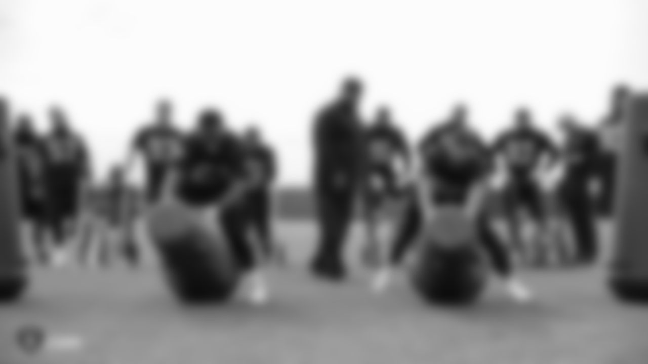 Raiders defensive tackle Ronald Ollie (63) and defensive end Clelin Ferrell (96) at a workout during phase two of the offseason program at the Raiders Practice Facility in Alameda, Calif.