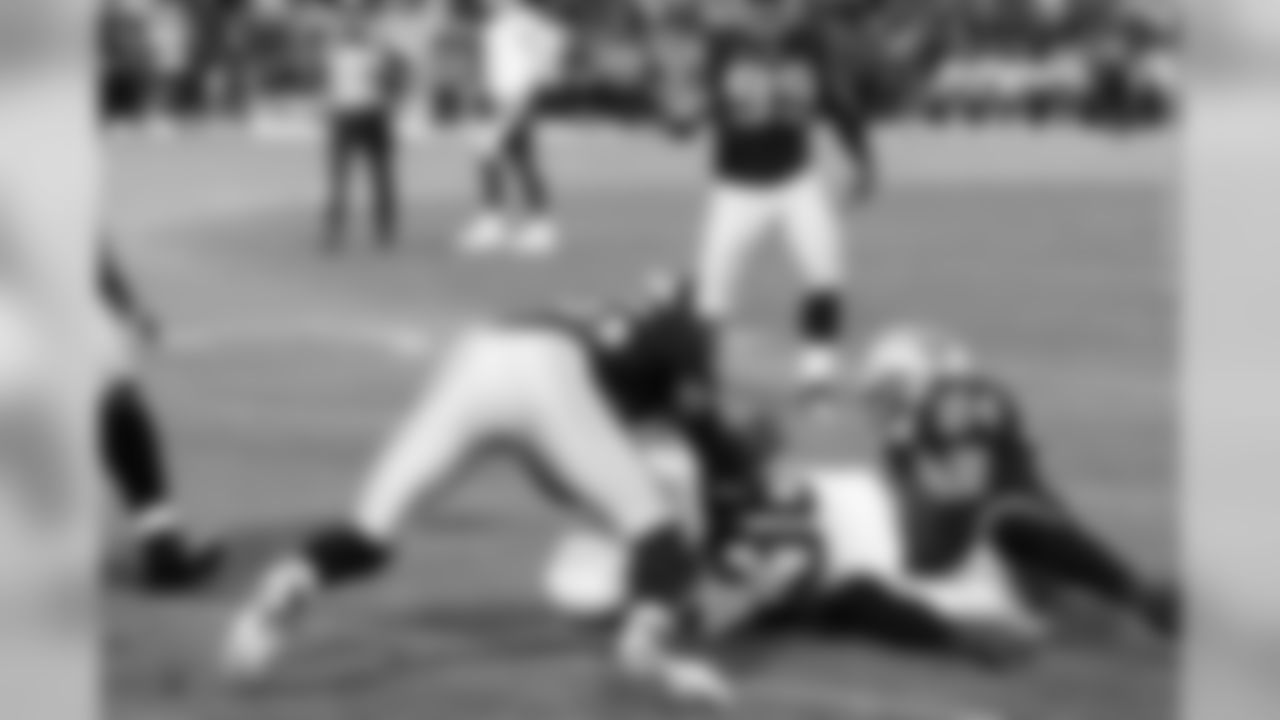 FS Michael Huff makes the tackle.