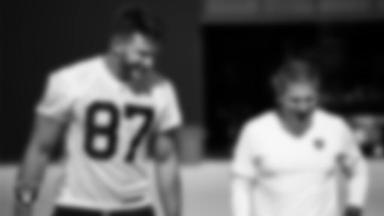 Las Vegas Raiders tight end Foster Moreau (87) and senior offensive assistant Jerry Schuplinski during practice at Intermountain Healthcare Performance Center.