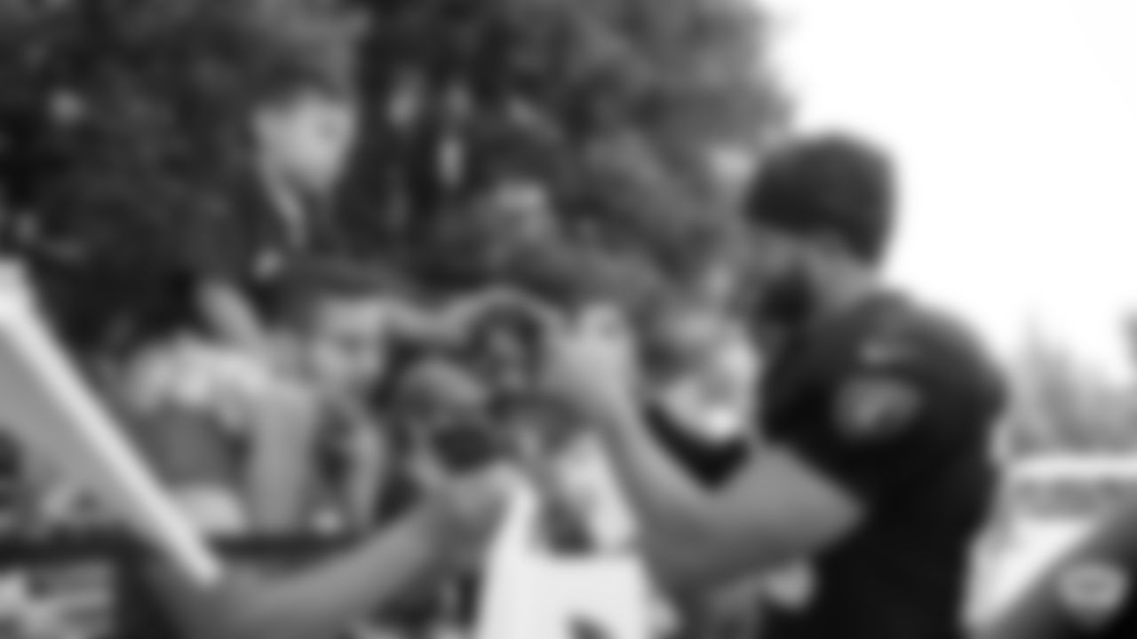 Raiders safety Erik Harris (25) signs autographs for fans after practice at 2019 Training Camp.