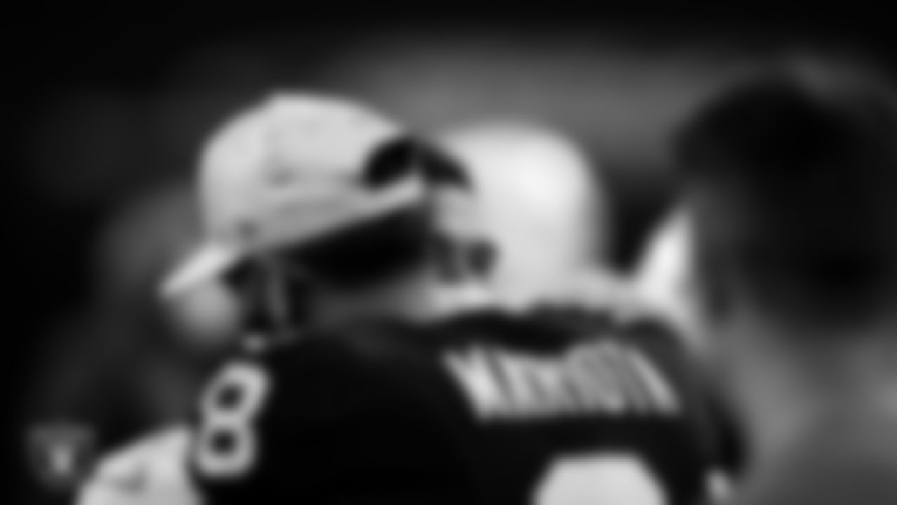 Las Vegas Raiders quarterback Marcus Mariota (8) with Miami Dolphins quarterback Tua Tagovailoa (1) after the regular season home game.