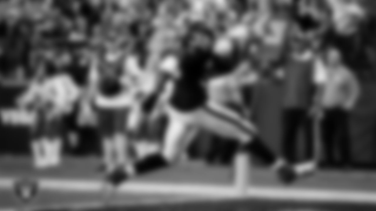 Las Vegas Raiders running back Brittain Brown (38) rushes for a 3-yard touchdown during the preseason home game against the New England Patriots at Allegiant Stadium.